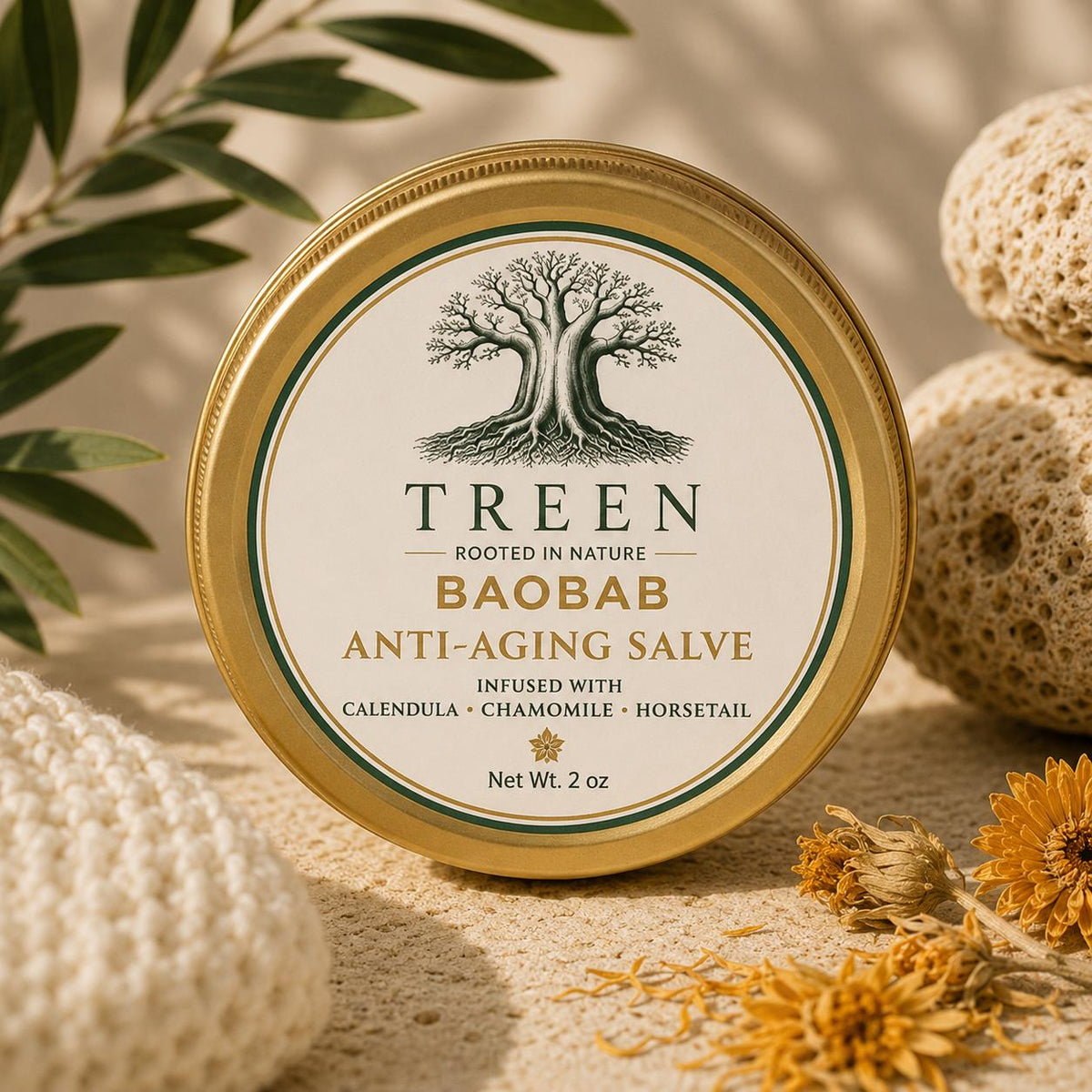 TREEN Anti-Aging Salve in a round gold tin styled with dried flowers, green leaves, and natural textures.
